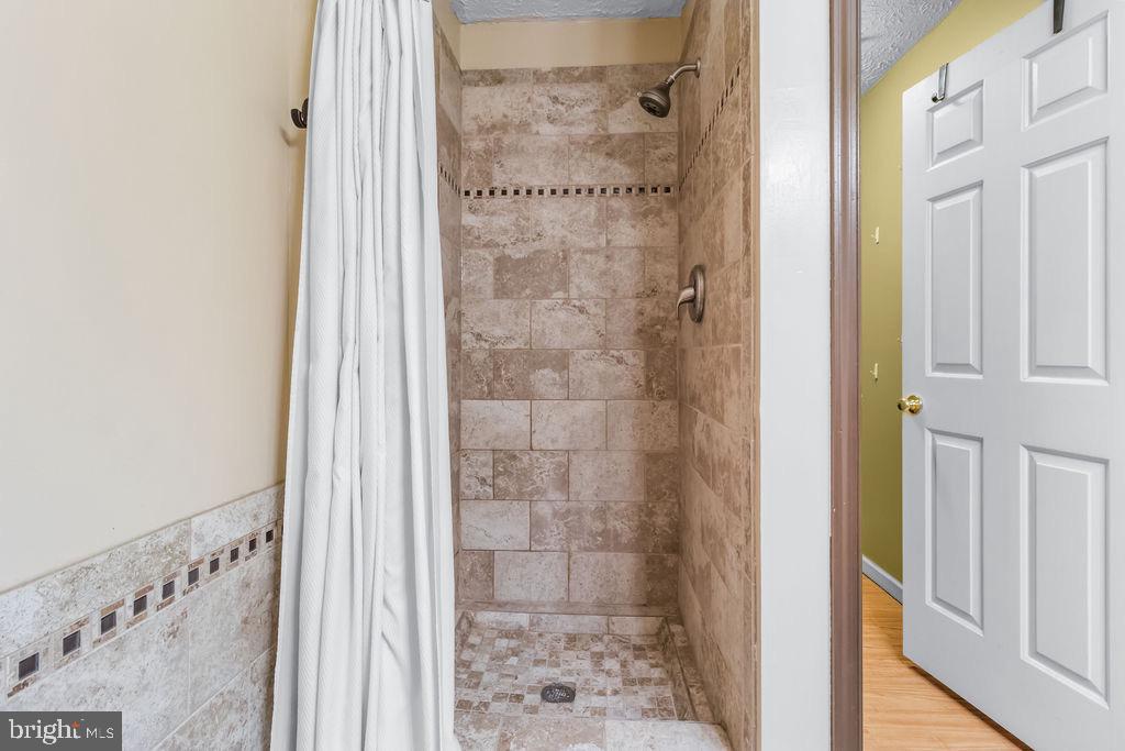 8605 Accokeek Street Laurel, MD 20724 - Photo 31 of 44 a bathroom with a shower