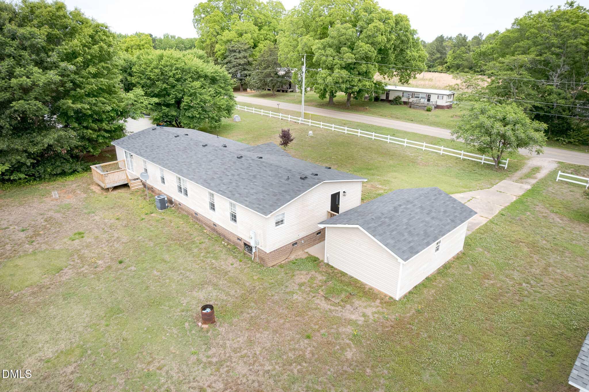 10037 Smith Road Middlesex, NC 27557 - Photo 33 of 36 a view of a house with pool and a yard