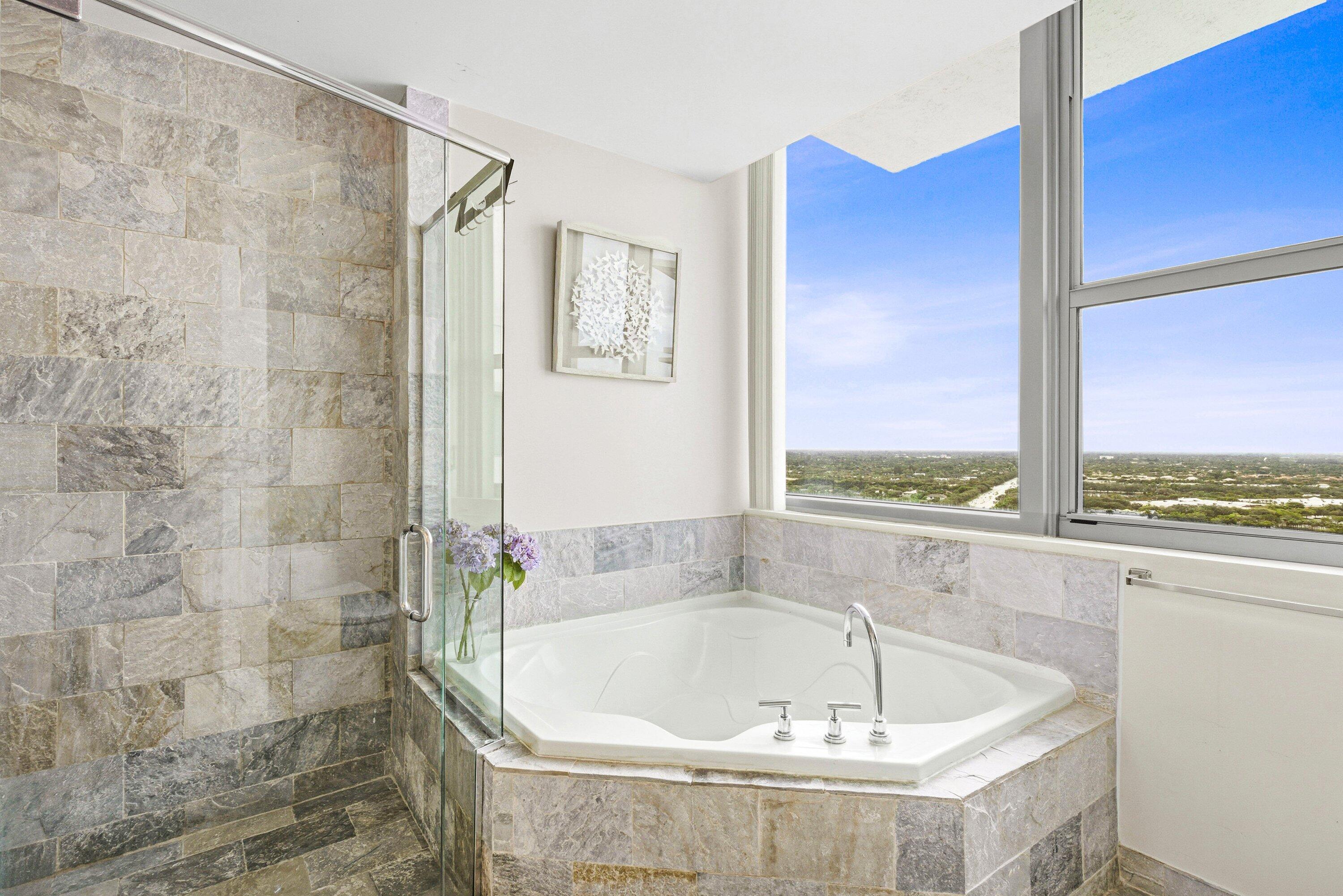 2641 North Flamingo Road, Unit 2701N Sunrise, FL 33323 - Photo 15 of 38 a bath tub sitting next to a window