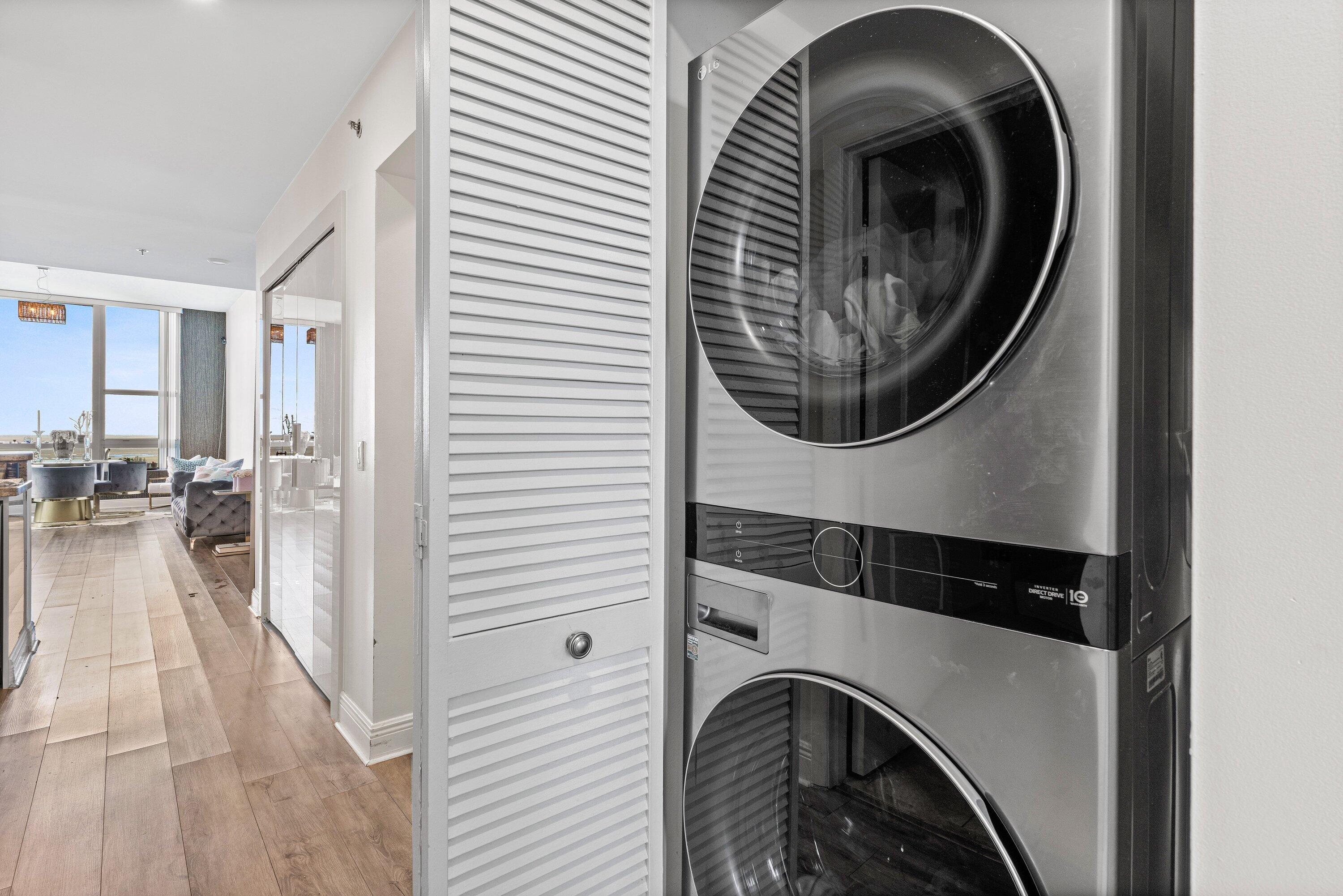 2641 North Flamingo Road, Unit 2701N Sunrise, FL 33323 - Photo 22 of 38 a view of a hallway with washer and dryer