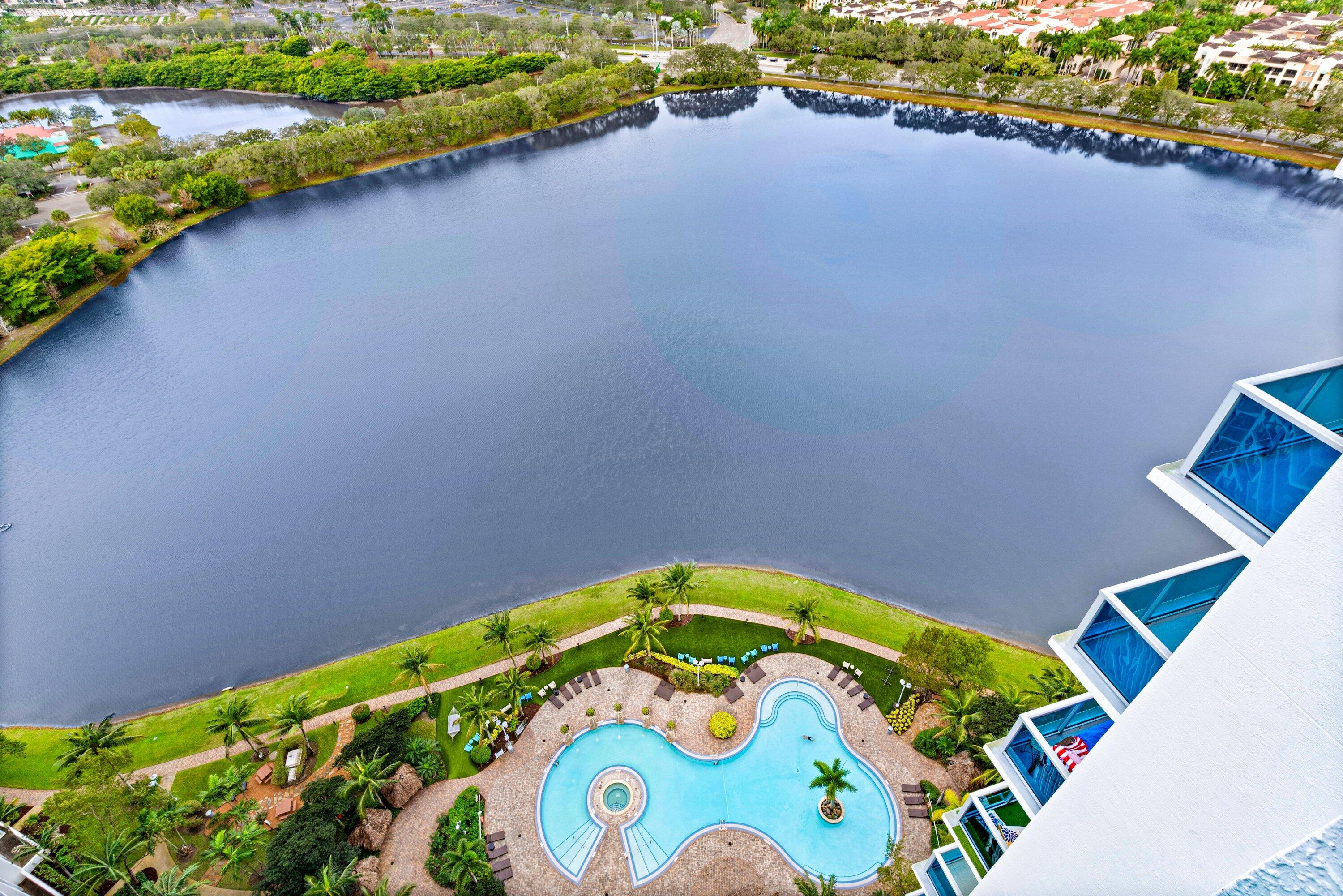 2641 North Flamingo Road, Unit 2701N Sunrise, FL 33323 - Photo 25 of 38 a view of swimming pool with a garden