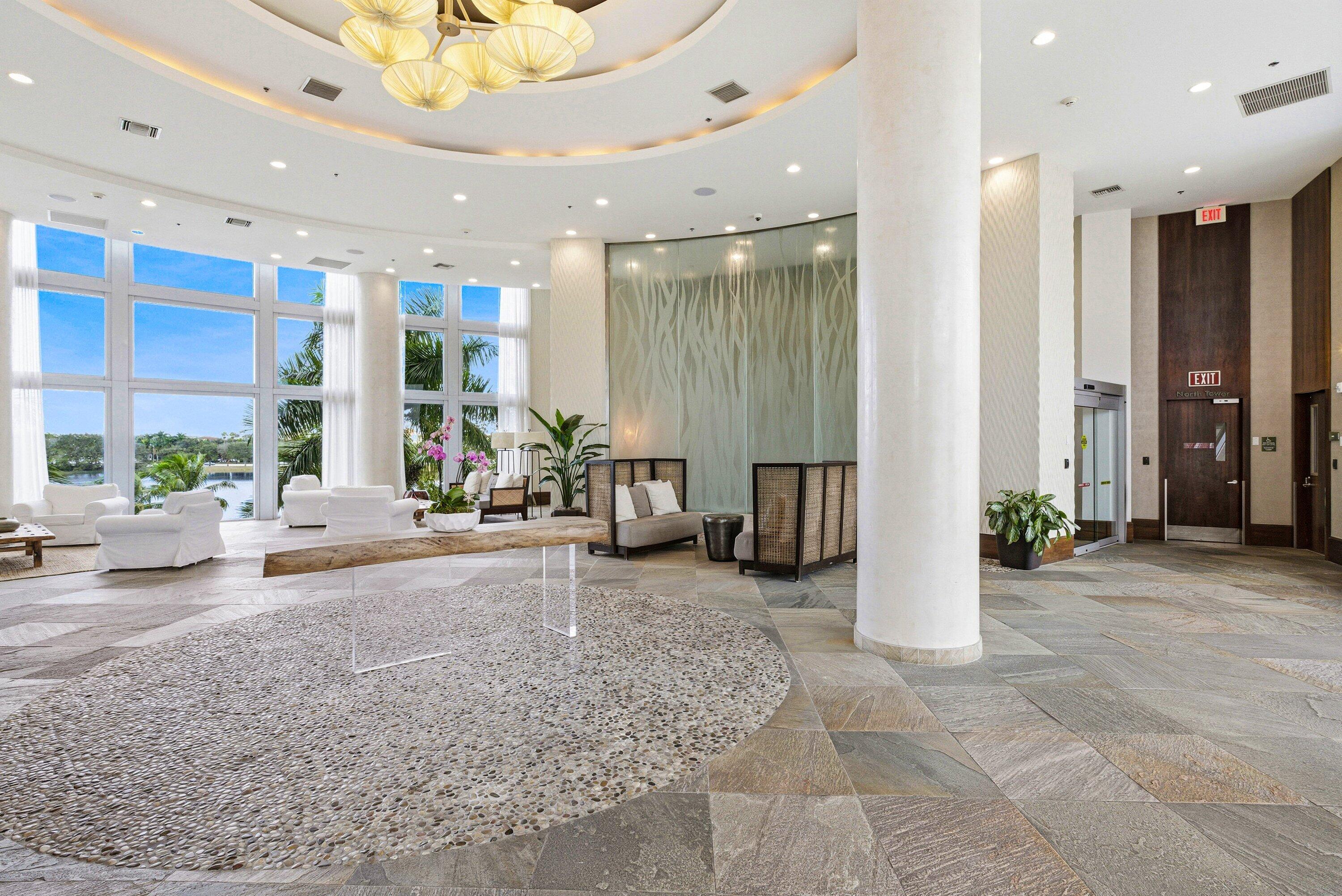 2641 North Flamingo Road, Unit 2701N Sunrise, FL 33323 - Photo 32 of 38 a living room with furniture and a potted plant