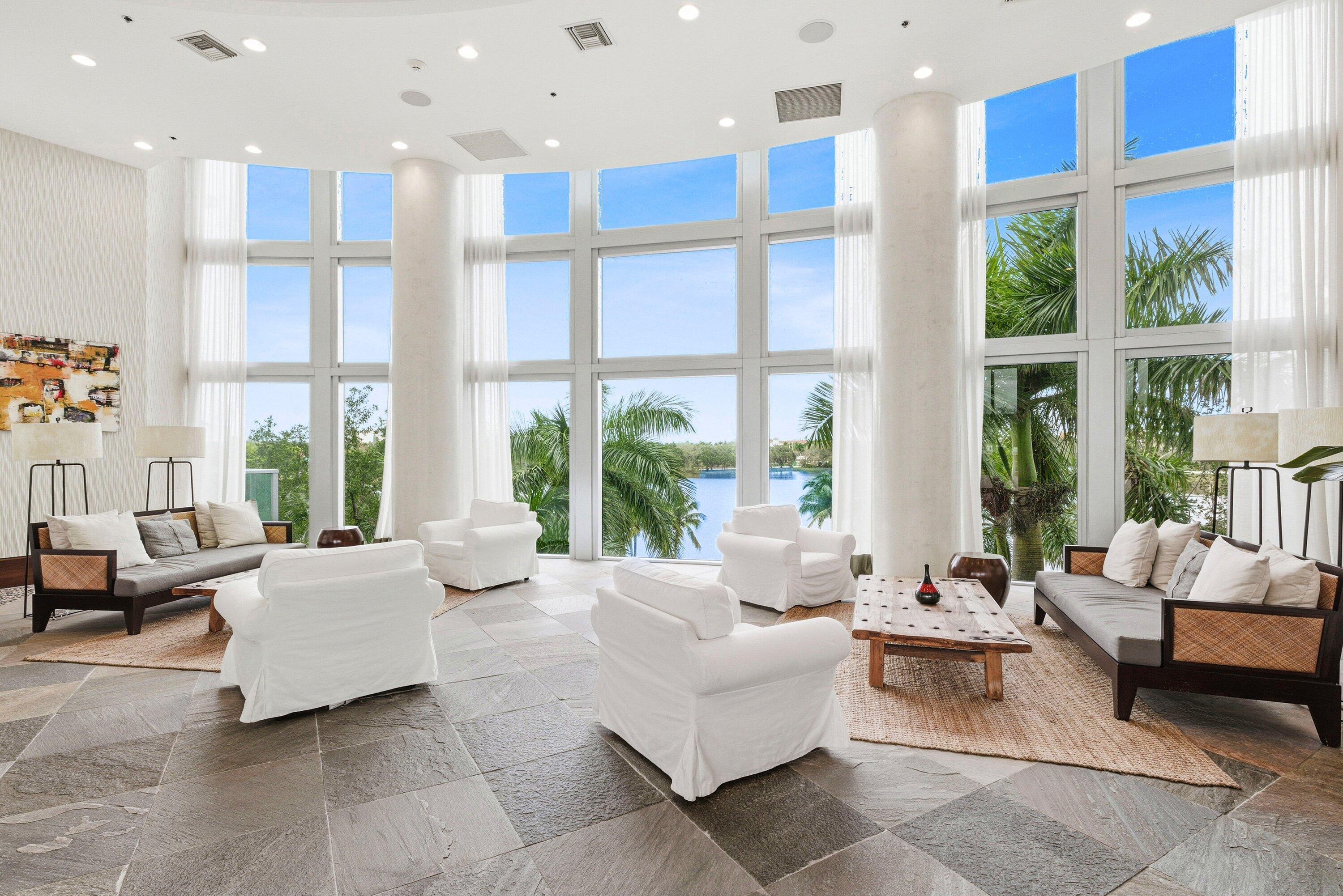 2641 North Flamingo Road, Unit 2701N Sunrise, FL 33323 - Photo 33 of 38 a living room with furniture and large windows