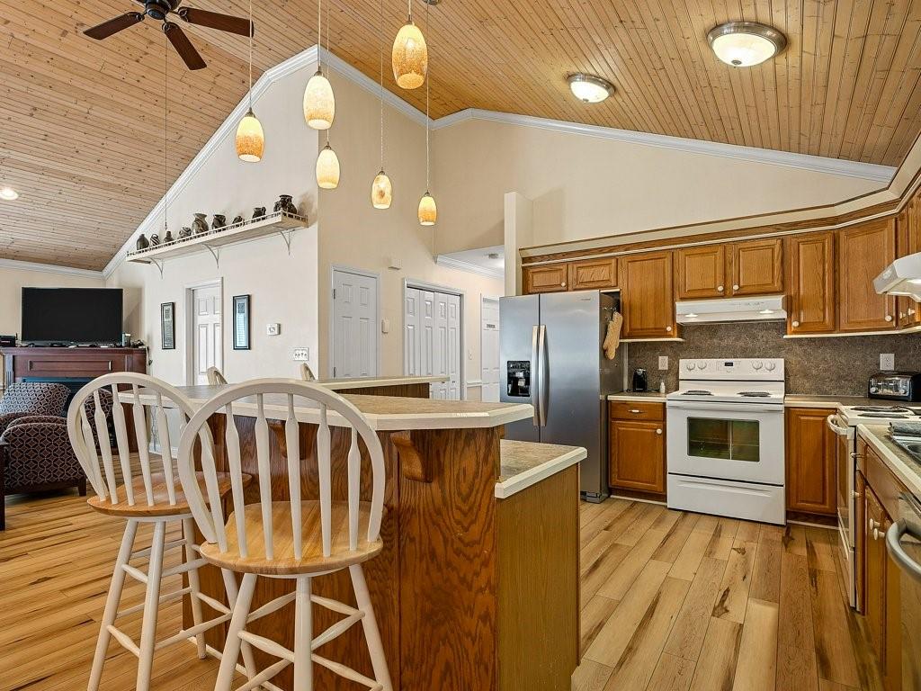 3245 Holly Road Connelly Springs, NC 28612 - Photo 12 of 39 a kitchen with stainless steel appliances a stove a sink dishwasher and a refrigerator