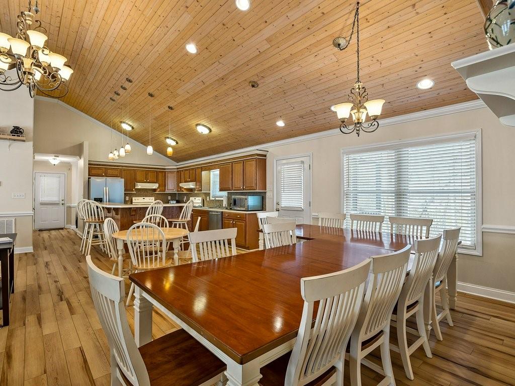 3245 Holly Road Connelly Springs, NC 28612 - Photo 14 of 39 a view of a dining room with furniture wooden floor and chandelier