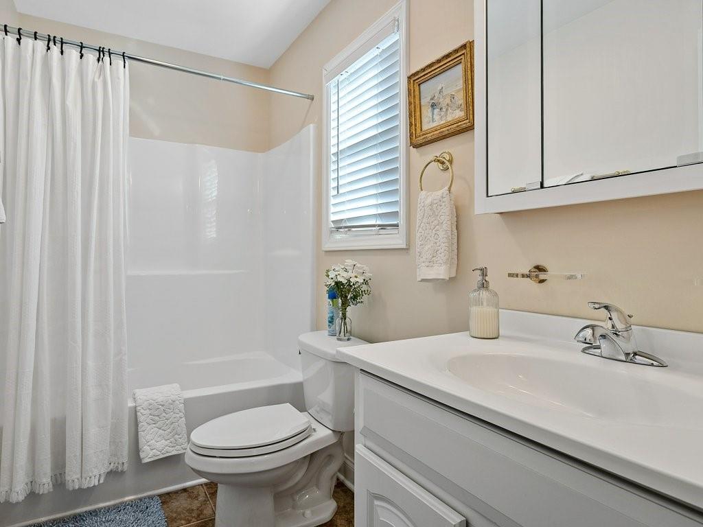 3245 Holly Road Connelly Springs, NC 28612 - Photo 18 of 39 a bathroom with a sink a toilet and a mirror