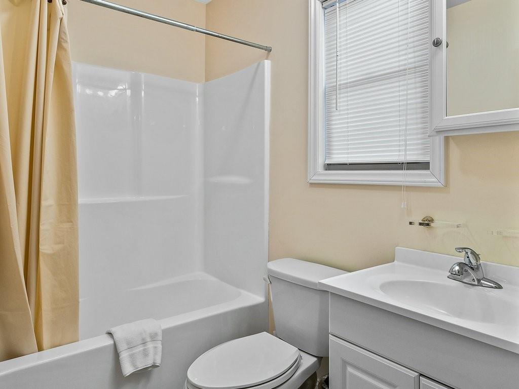3245 Holly Road Connelly Springs, NC 28612 - Photo 24 of 39 a bathroom with a sink toilet and shower
