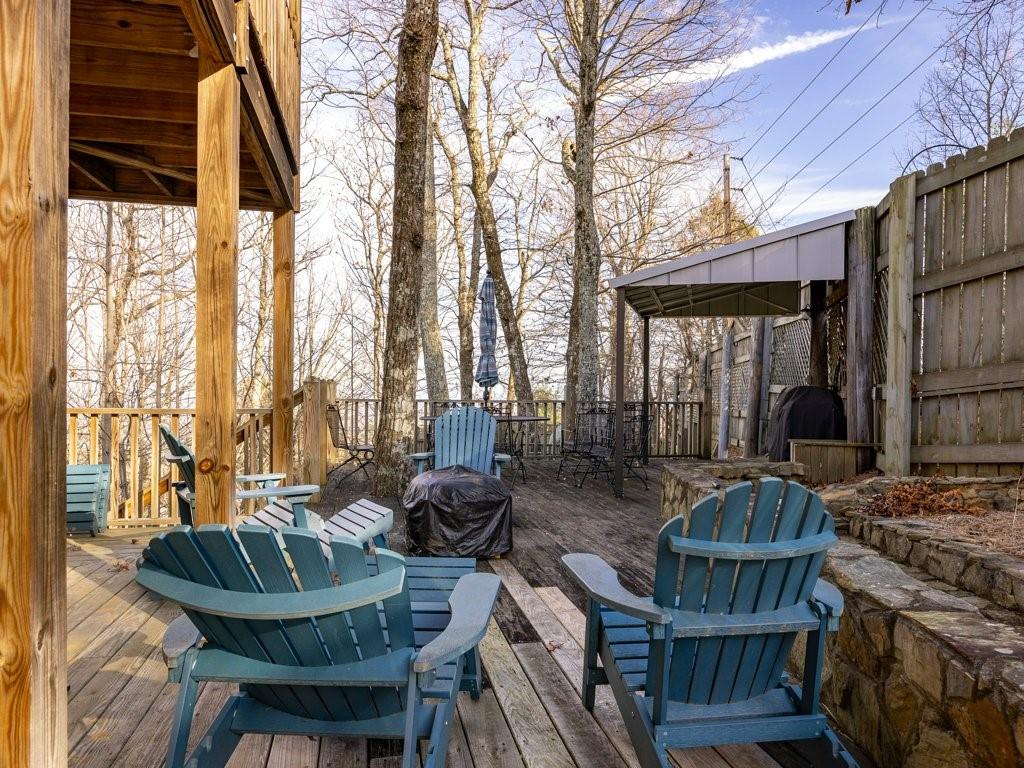 3245 Holly Road Connelly Springs, NC 28612 - Photo 30 of 39 a view of a patio with couches table and chairs and potted plants
