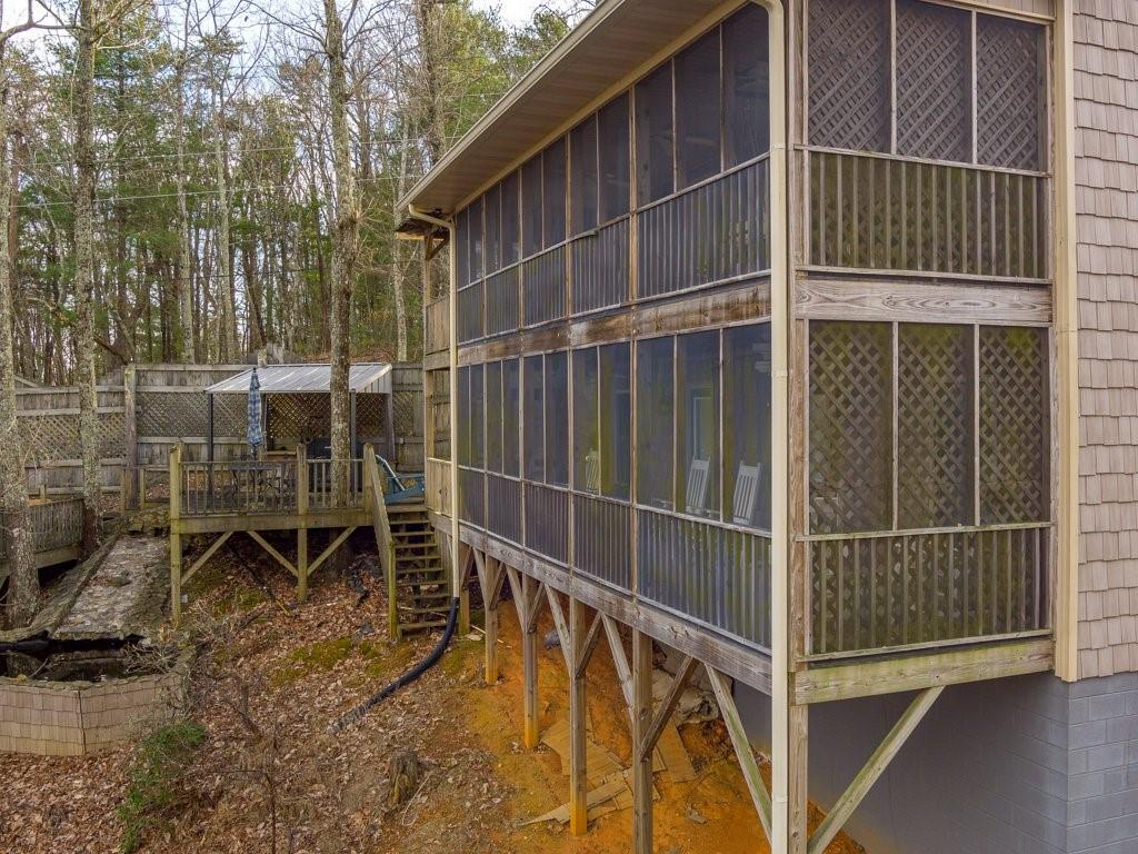 3245 Holly Road Connelly Springs, NC 28612 - Photo 34 of 39 a view of outdoor space with wooden deck and furniture