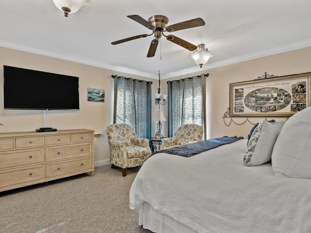 3245 Holly Road Connelly Springs, NC 28612 - Photo 5 of 39 a spacious bedroom with a bed and a flat screen tv