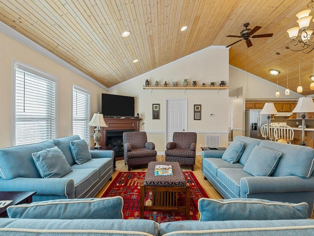 3245 Holly Road Connelly Springs, NC 28612 - Photo 10 of 39 a living room with furniture and a flat screen tv