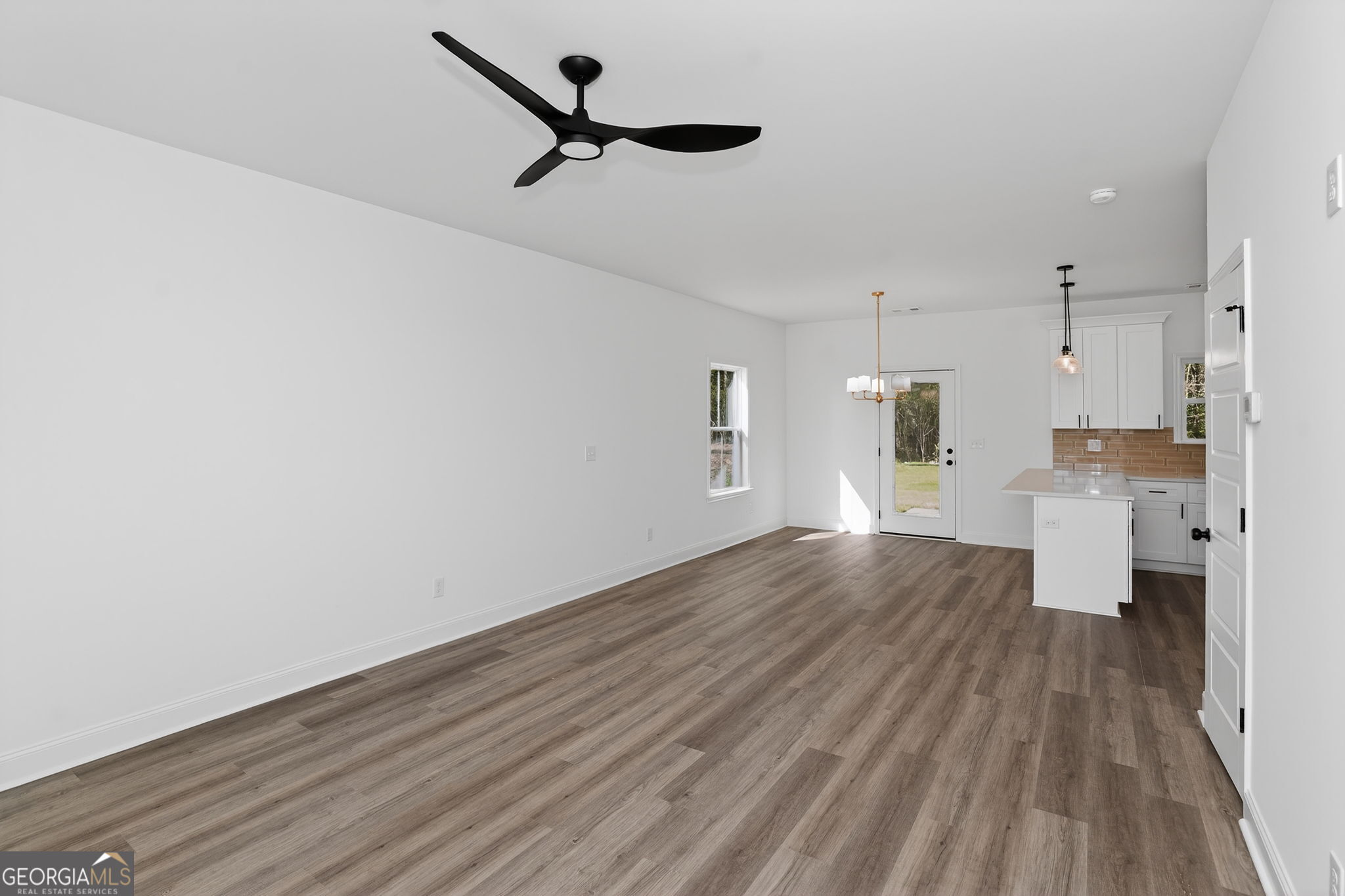 1229 Chappell Mill Road Jackson, GA 30233 - Photo 19 of 55 a view of empty room with wooden floor and window