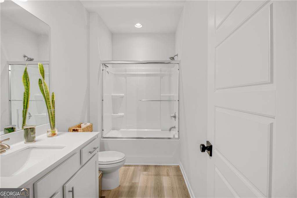 338 Ryston Way Grayson, GA 30017 - Photo 11 of 61 a bathroom with a sink a toilet and shower