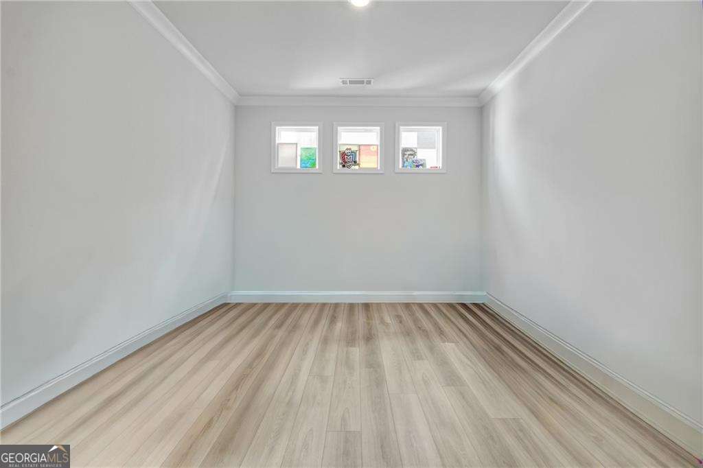 338 Ryston Way Grayson, GA 30017 - Photo 12 of 61 wooden floor in an empty room with a window