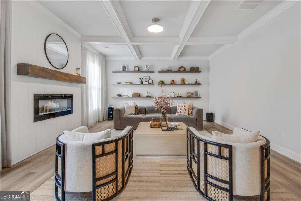 338 Ryston Way Grayson, GA 30017 - Photo 13 of 61 a living room with furniture a flat screen tv and a fireplace