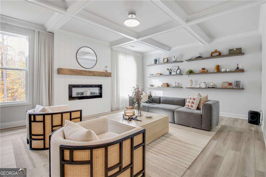 338 Ryston Way Grayson, GA 30017 - Photo 14 of 61 a living room with furniture a fireplace and a large window