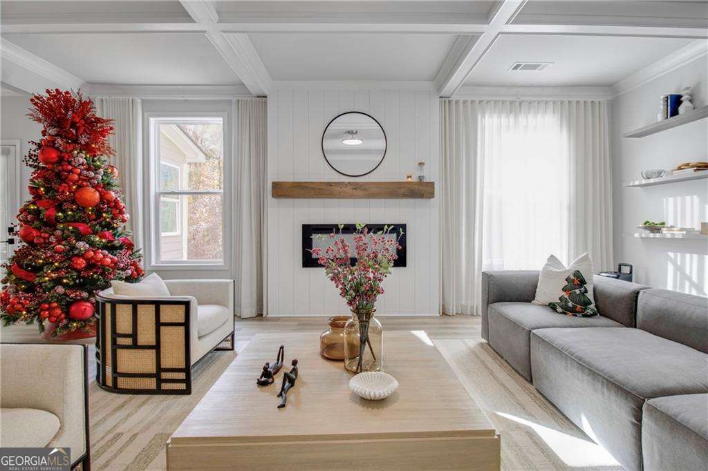 338 Ryston Way Grayson, GA 30017 - Photo 15 of 61 a living room with furniture a potted plant and a chandelier