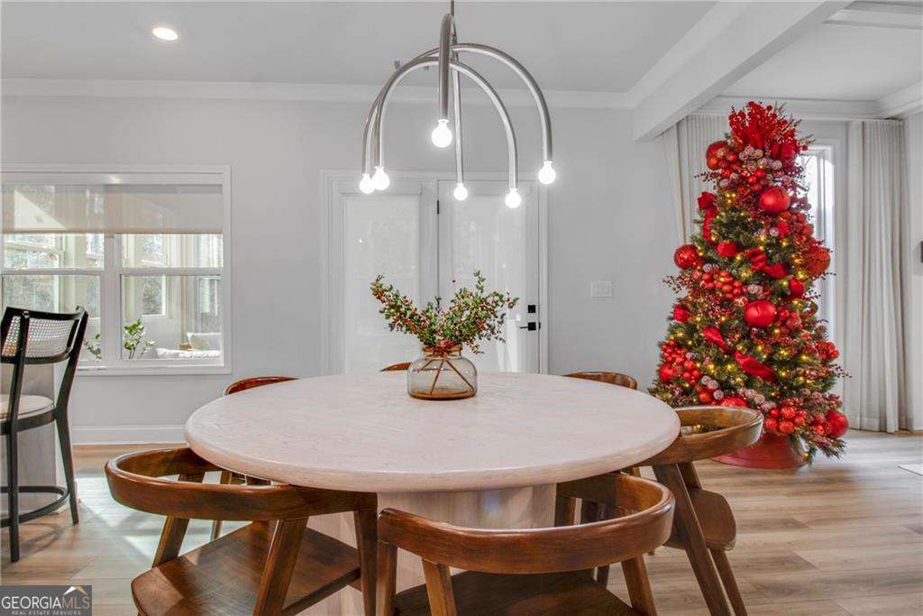 338 Ryston Way Grayson, GA 30017 - Photo 17 of 61 a view of a dining room with furniture and wooden floor