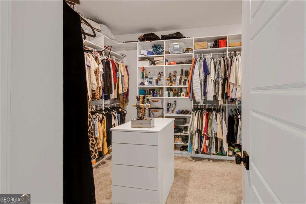 338 Ryston Way Grayson, GA 30017 - Photo 29 of 61 a view of walk in closet with clothes and shoes