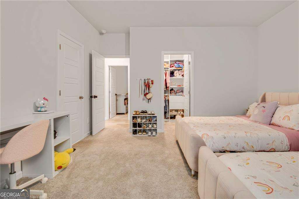 338 Ryston Way Grayson, GA 30017 - Photo 35 of 61 a bedroom with a bed and furniture