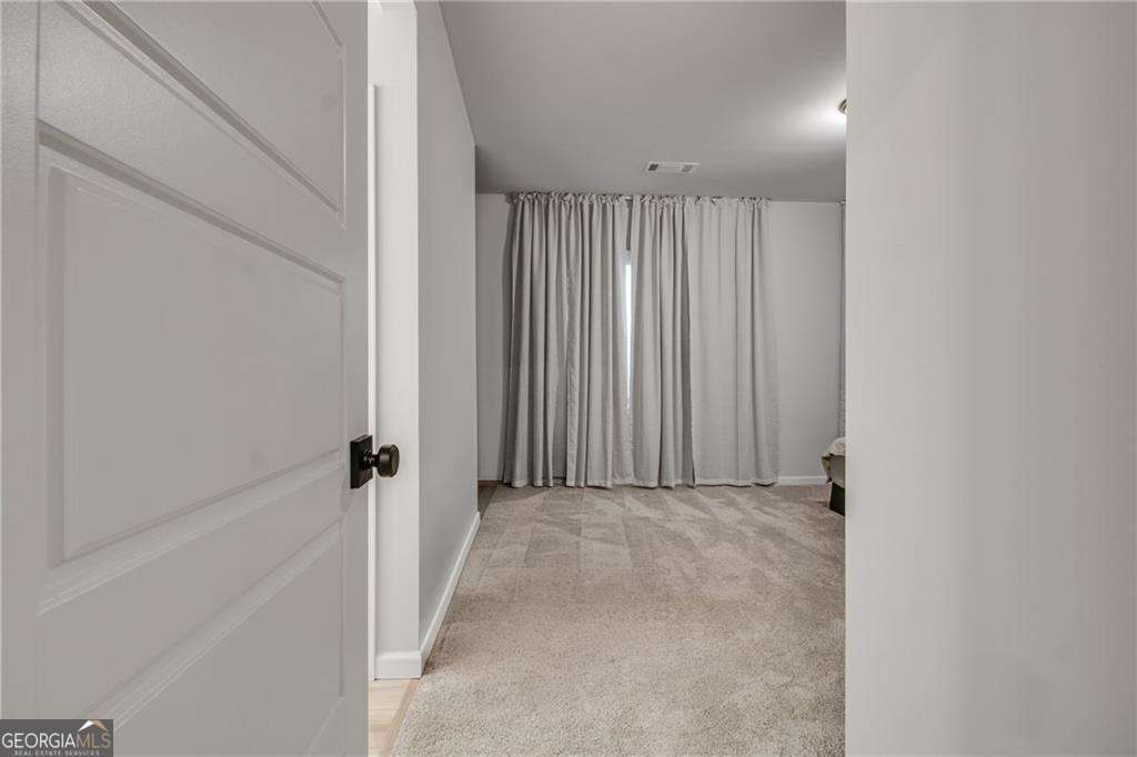 338 Ryston Way Grayson, GA 30017 - Photo 39 of 61 a view of a room with a white door