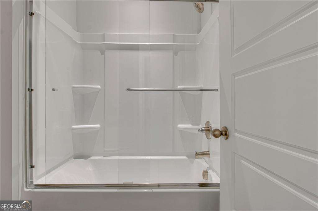 338 Ryston Way Grayson, GA 30017 - Photo 43 of 61 a bathroom with a bathtub