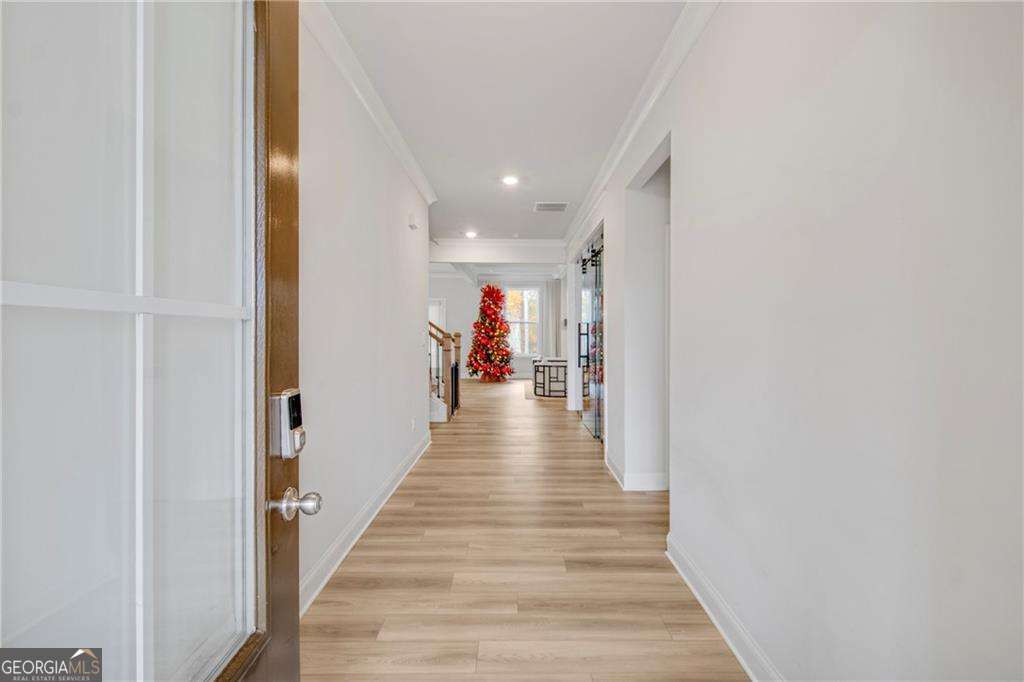 338 Ryston Way Grayson, GA 30017 - Photo 5 of 61 a view of a hallway with wooden floor