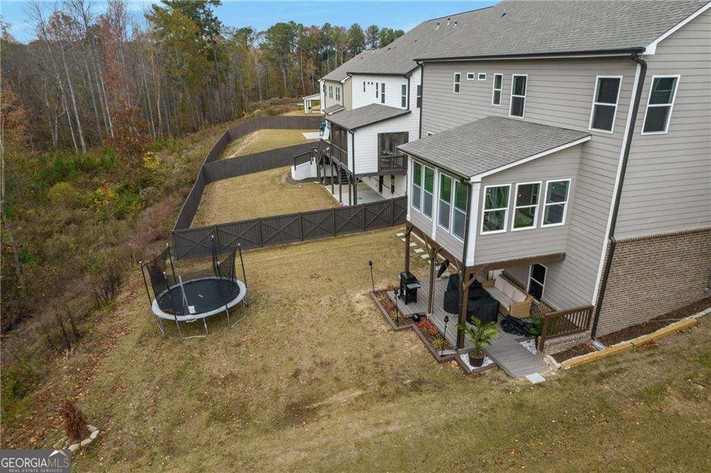 338 Ryston Way Grayson, GA 30017 - Photo 54 of 61 an aerial view of a house with backyard space and balcony