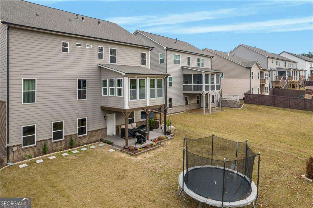 338 Ryston Way Grayson, GA 30017 - Photo 55 of 61 a view of a patio with swimming pool table and chairs