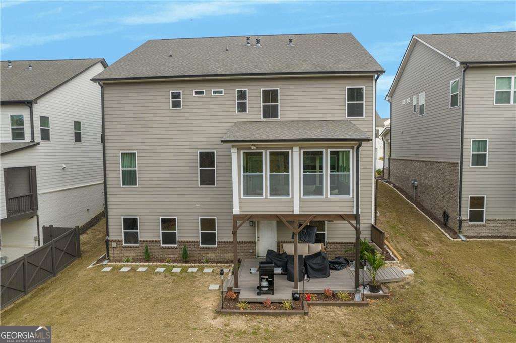 338 Ryston Way Grayson, GA 30017 - Photo 56 of 61 a front view of a house with large windows