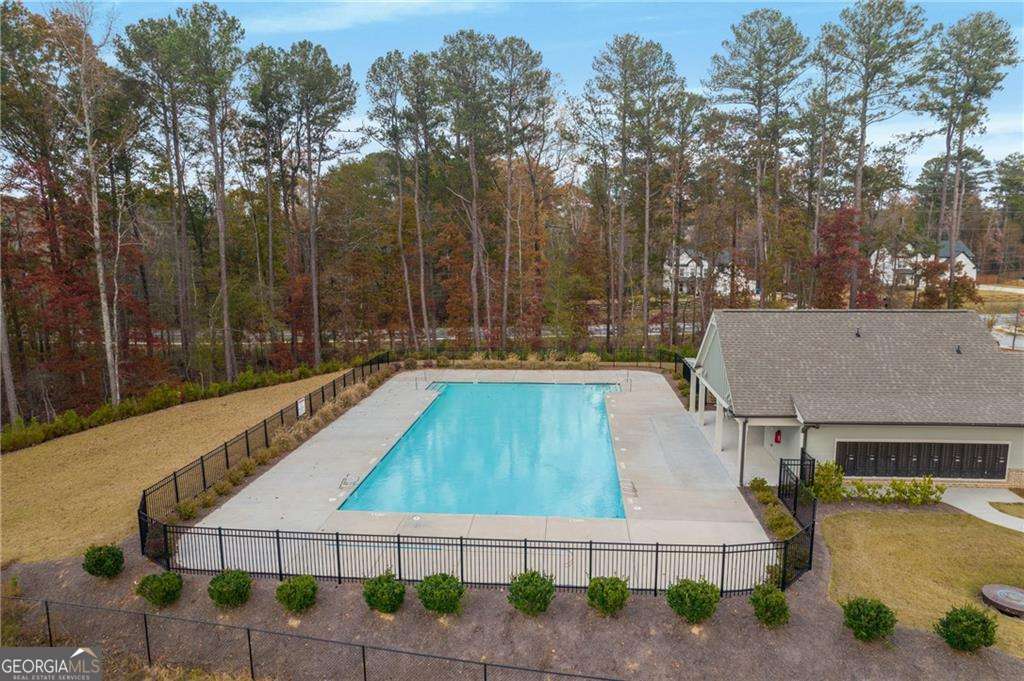 338 Ryston Way Grayson, GA 30017 - Photo 58 of 61 a view of a swimming pool with a patio and a yard