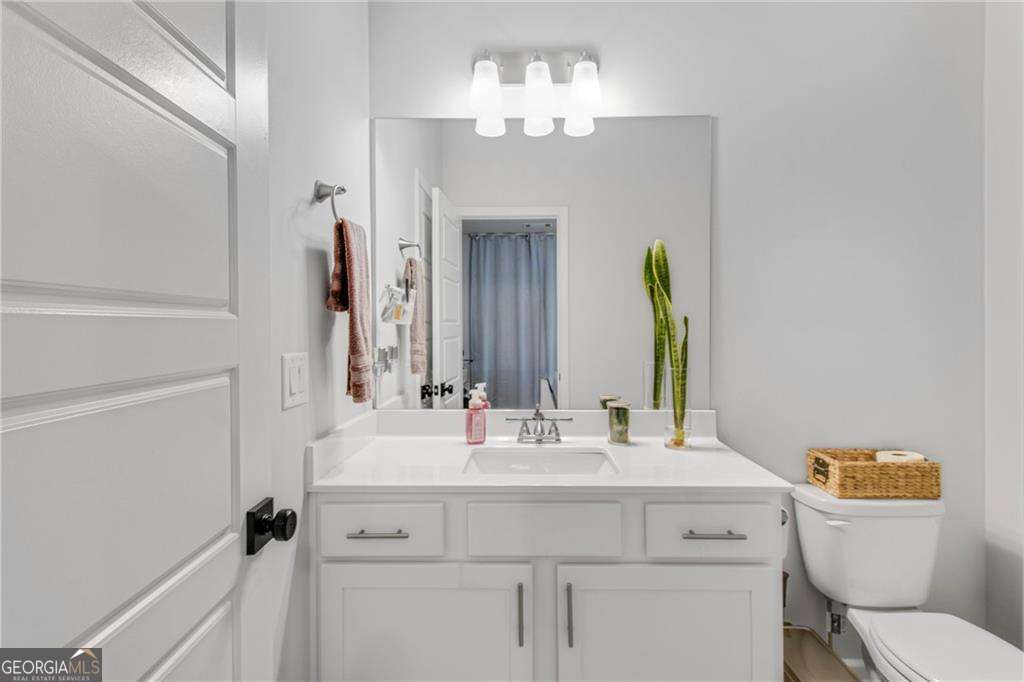 338 Ryston Way Grayson, GA 30017 - Photo 10 of 61 a bathroom with a sink vanity mirror and toilet
