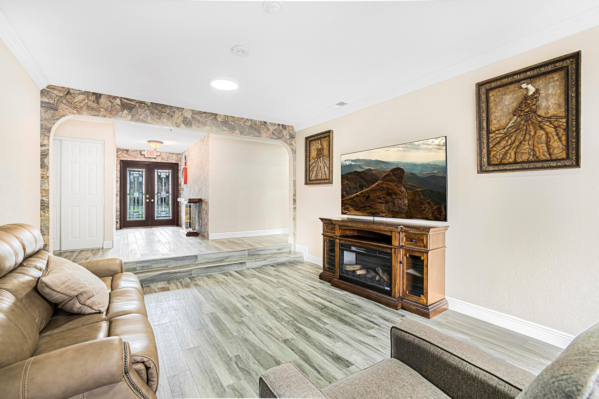 3374 Northwest 27th Terrace Boca Raton, FL 33434 - Photo 11 of 33 a living room with furniture and a fireplace