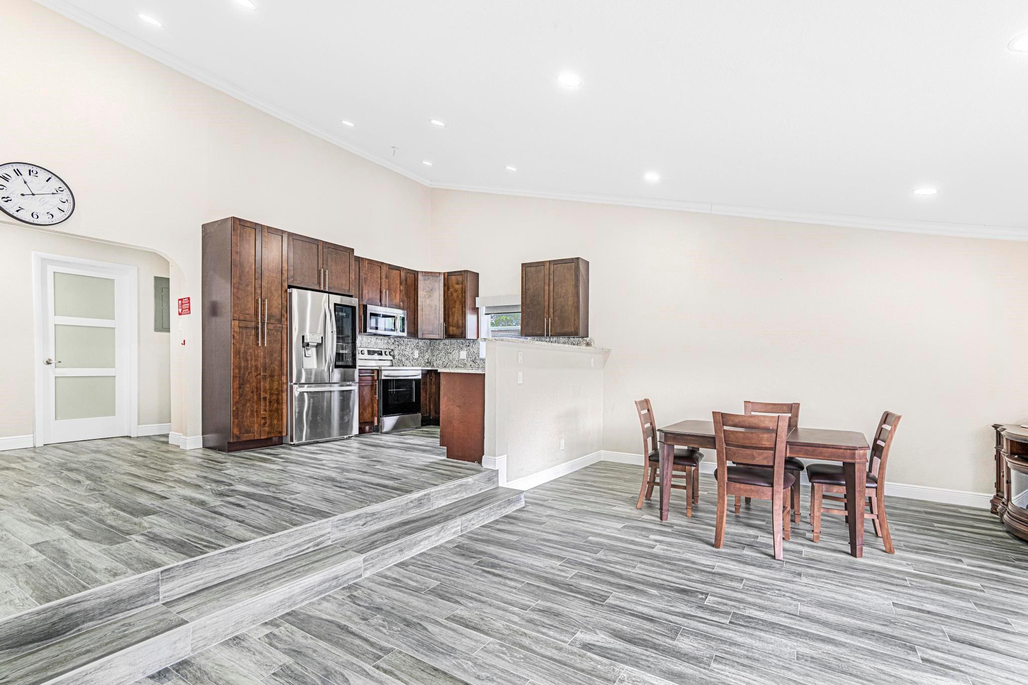 3374 Northwest 27th Terrace Boca Raton, FL 33434 - Photo 13 of 33 a view of a dining room with furniture