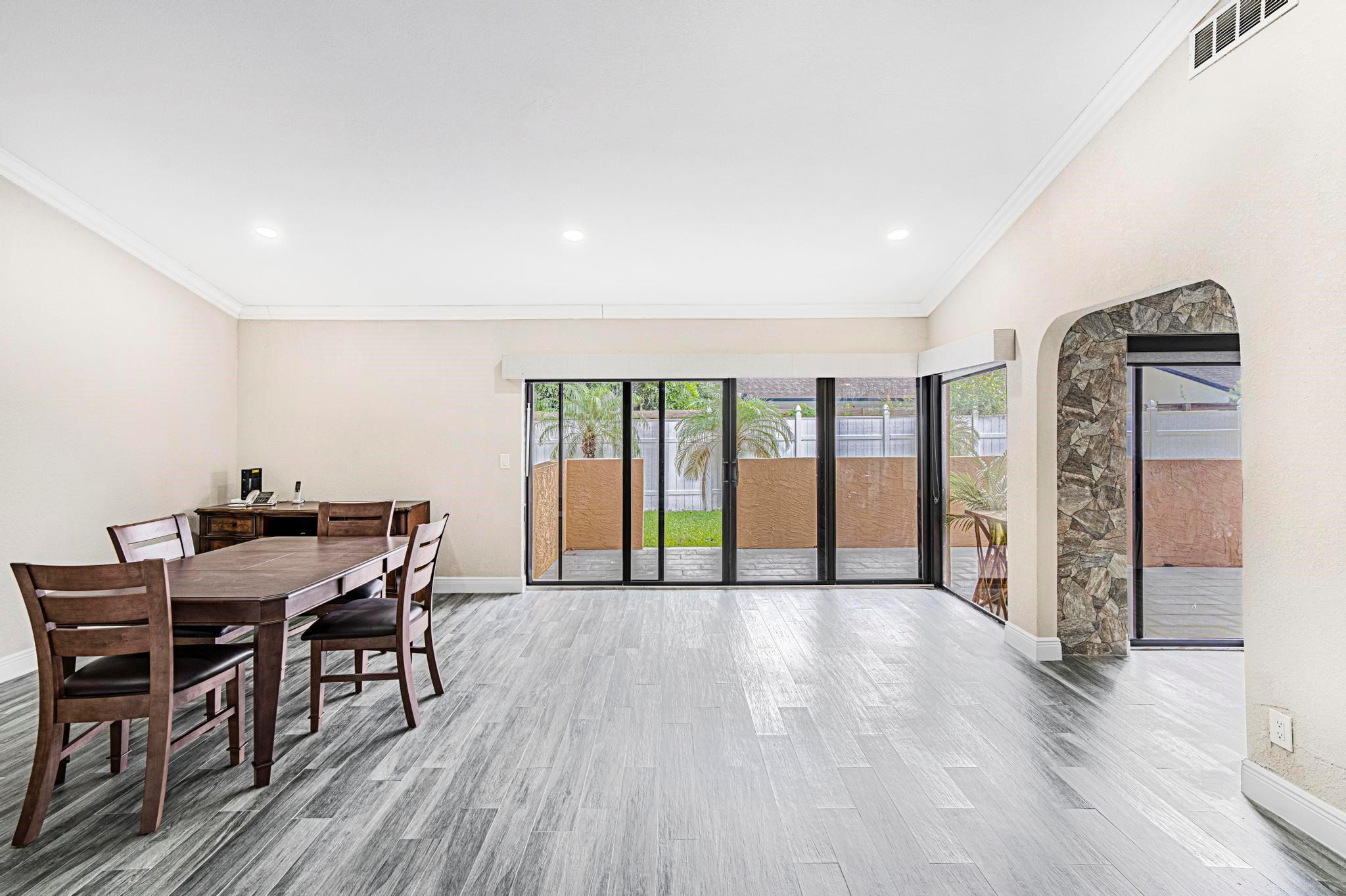 3374 Northwest 27th Terrace Boca Raton, FL 33434 - Photo 15 of 33 a view of a livingroom with furniture window and wooden floor