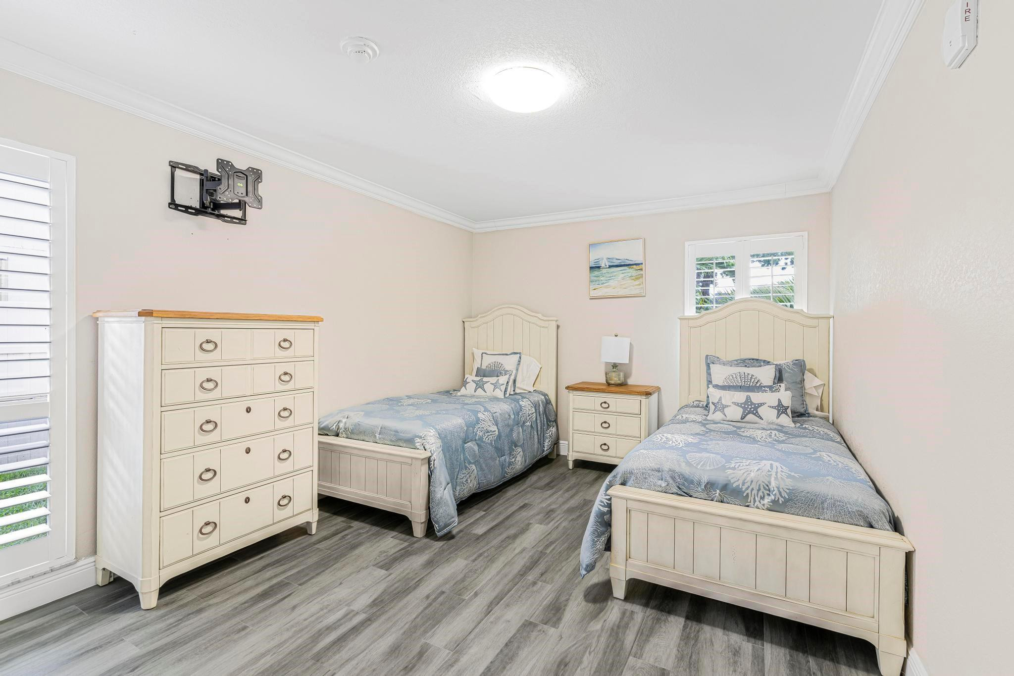 3374 Northwest 27th Terrace Boca Raton, FL 33434 - Photo 20 of 33 a bedroom with two beds and painting on the wall