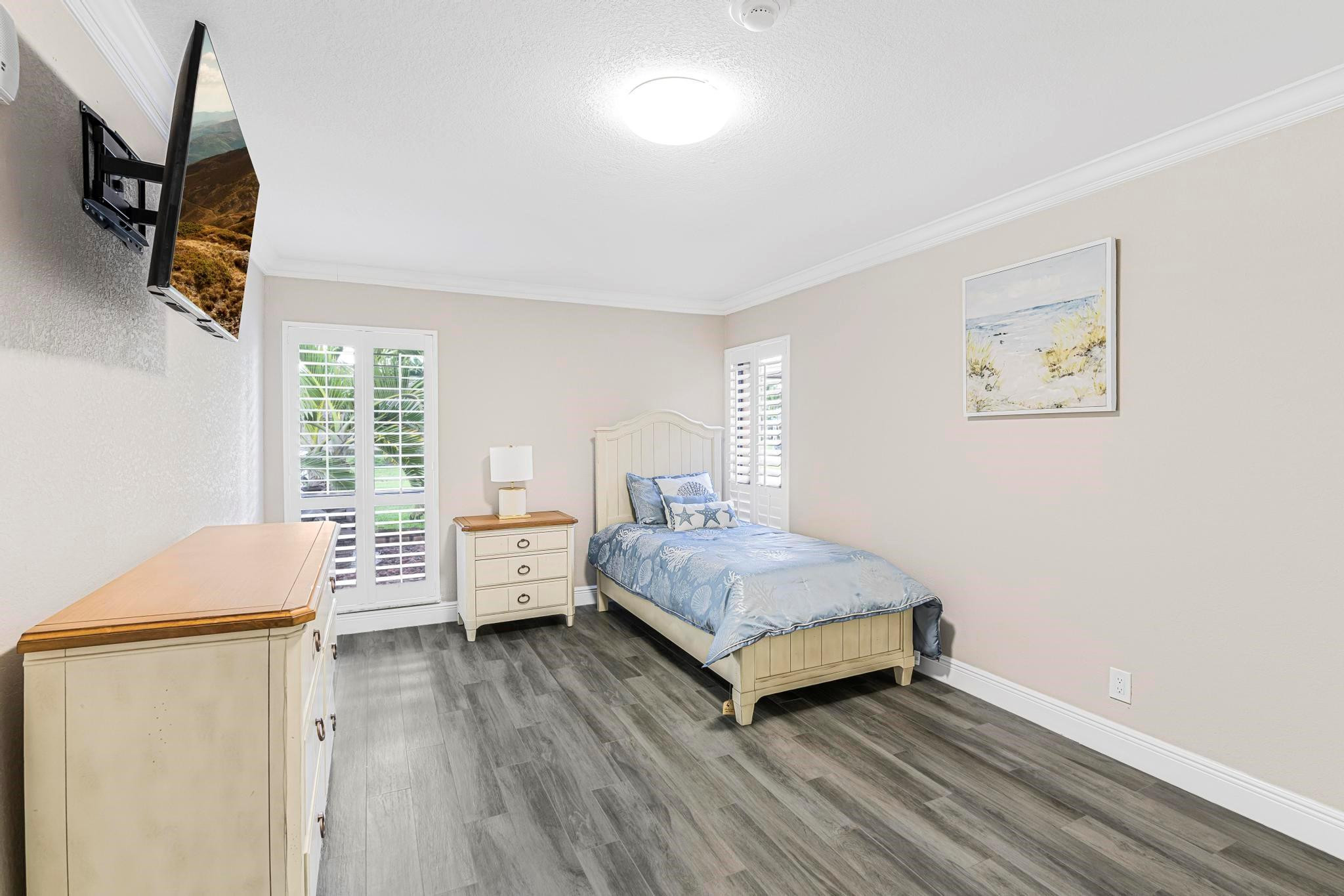 3374 Northwest 27th Terrace Boca Raton, FL 33434 - Photo 21 of 33 a bedroom with a bed and a window