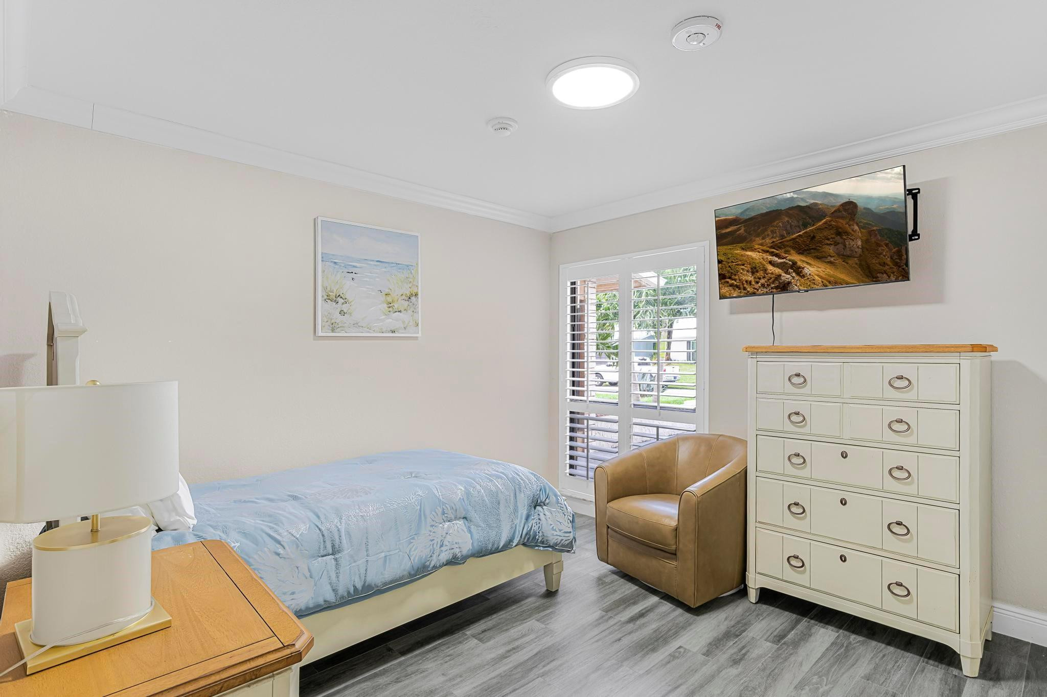 3374 Northwest 27th Terrace Boca Raton, FL 33434 - Photo 23 of 33 a bedroom with furniture and a bed