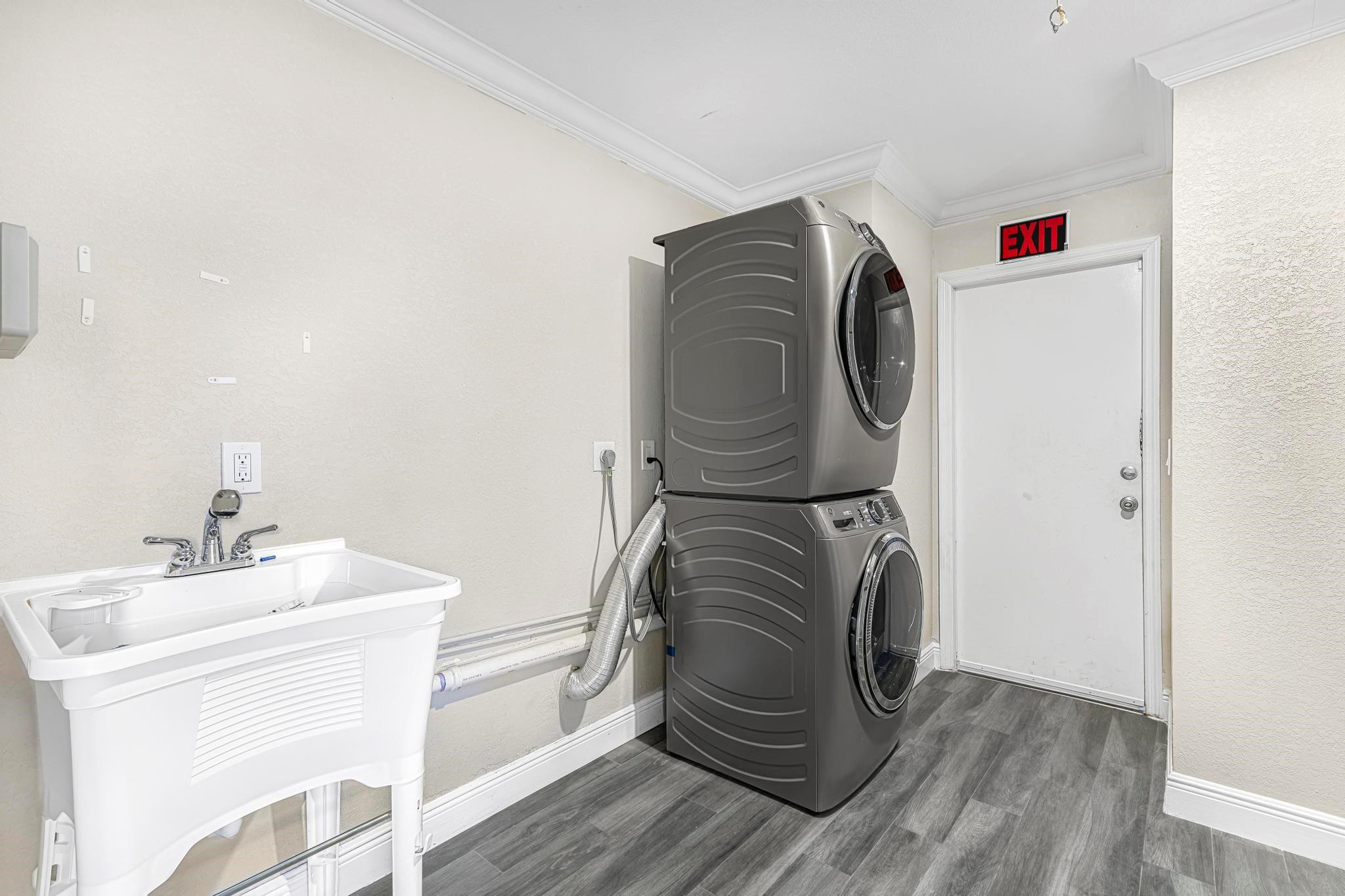 3374 Northwest 27th Terrace Boca Raton, FL 33434 - Photo 26 of 33 a utility room with dryer and washer
