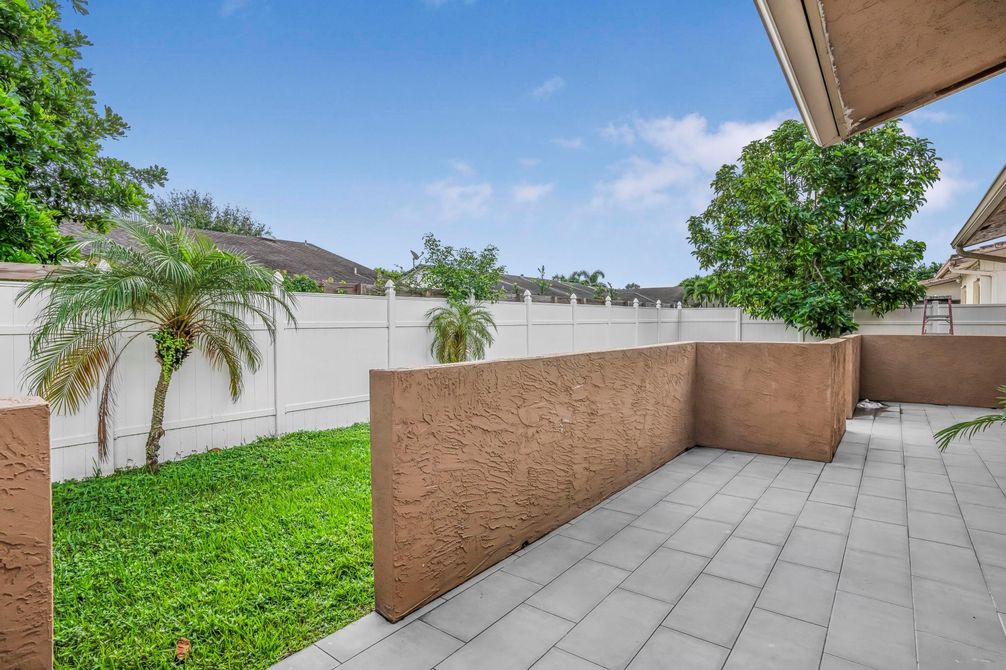 3374 Northwest 27th Terrace Boca Raton, FL 33434 - Photo 29 of 33 a view of a terrace with a garden