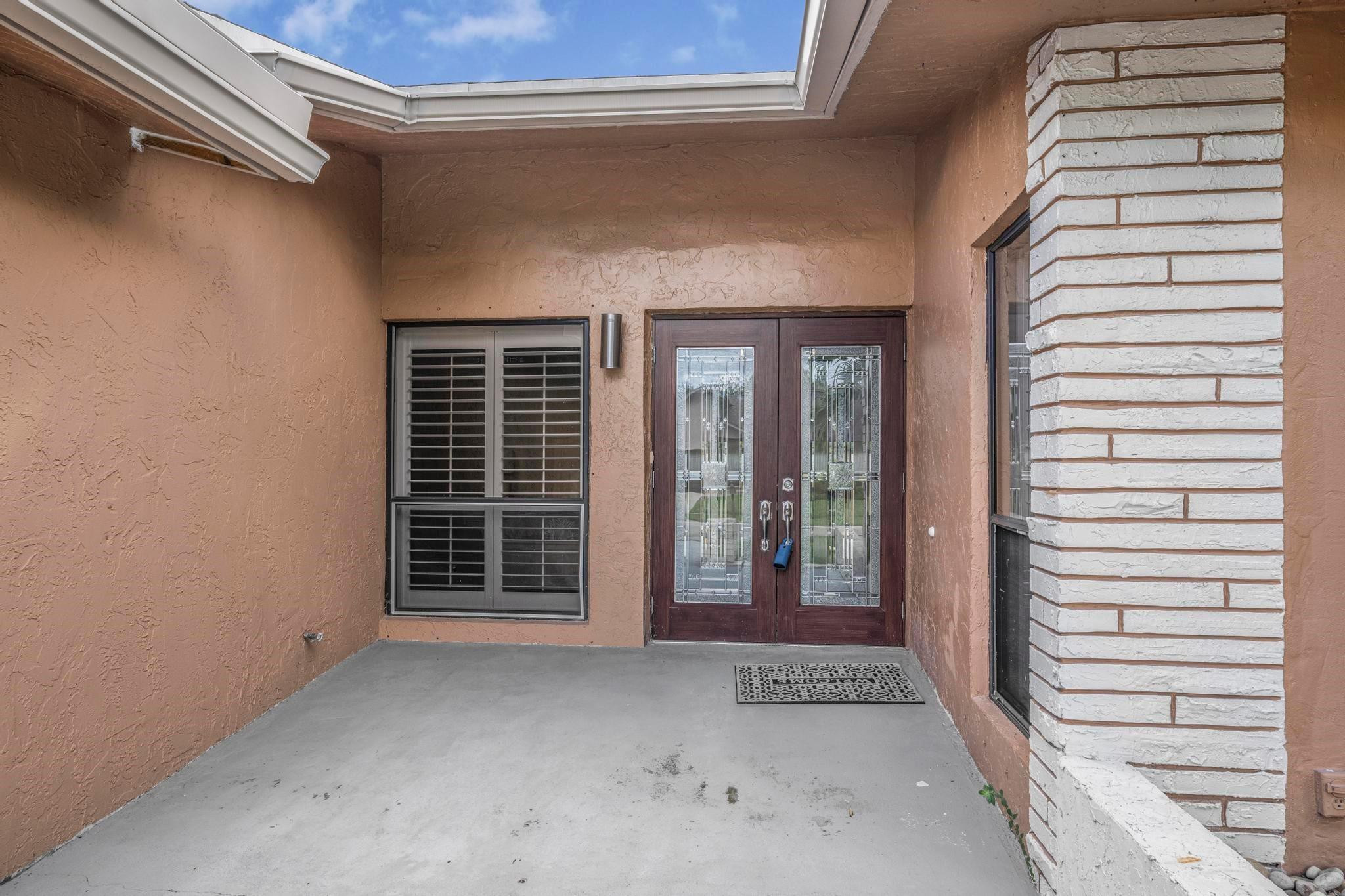 3374 Northwest 27th Terrace Boca Raton, FL 33434 - Photo 8 of 33 a view of front door