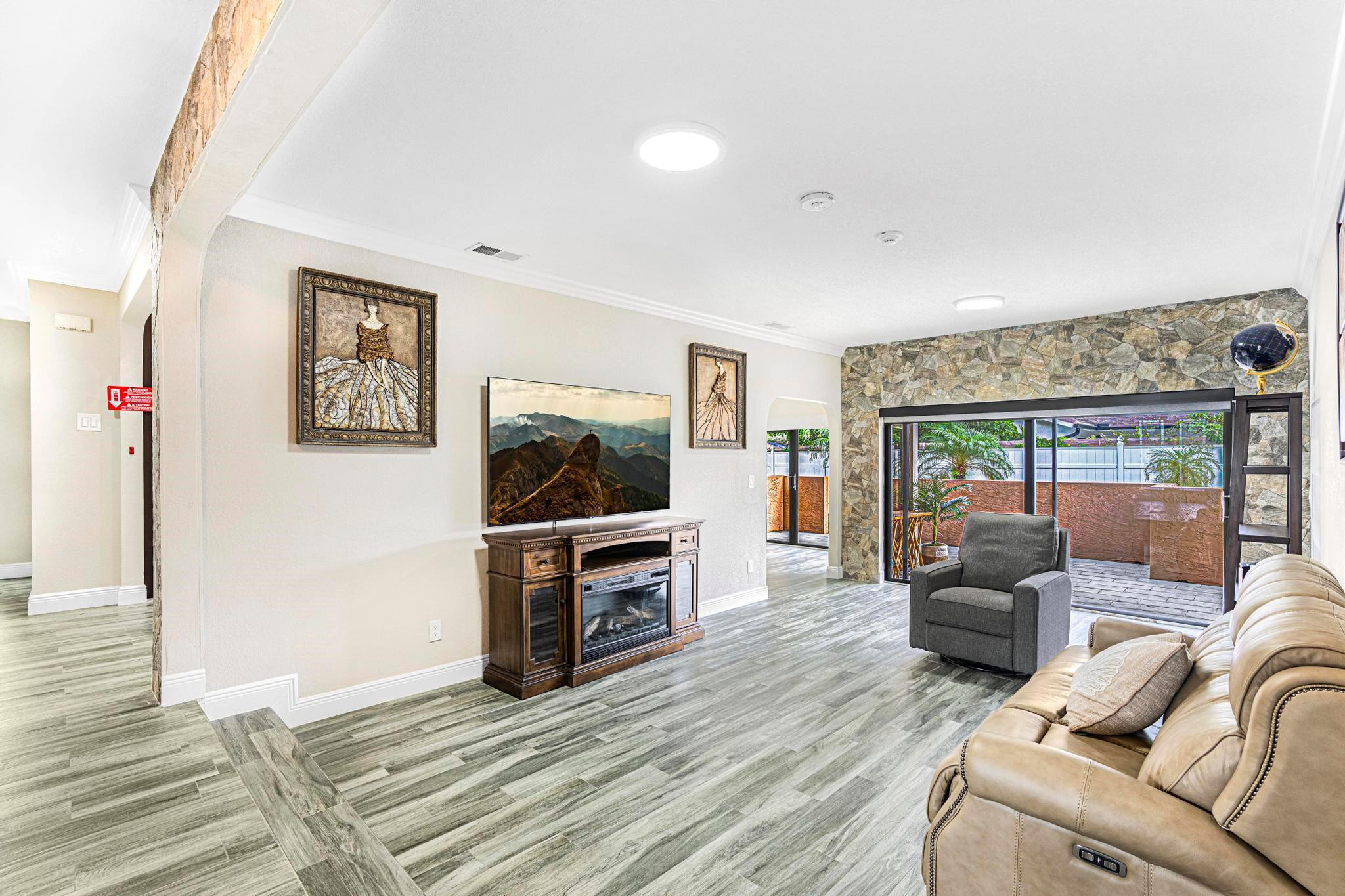 3374 Northwest 27th Terrace Boca Raton, FL 33434 - Photo 10 of 33 a living room with furniture and a flat screen tv