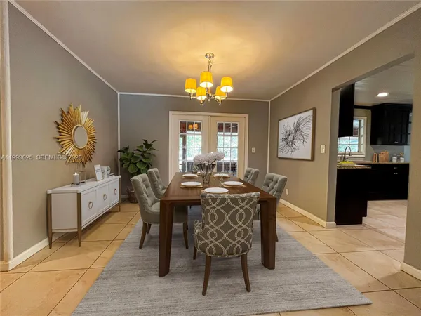 a kitchen with stainless steel appliances granite countertop a refrigerator a sink a stove a microwave and island