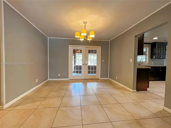a large kitchen with stainless steel appliances granite countertop a sink and cabinets