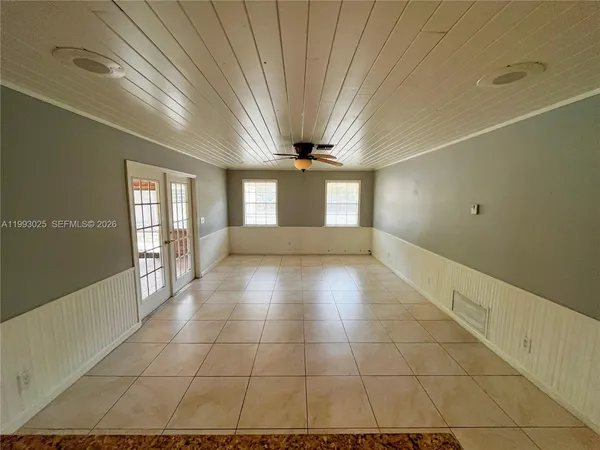 a view of a room with a large window
