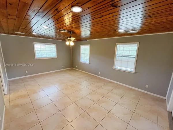 a view of hallway with a shower and a sink