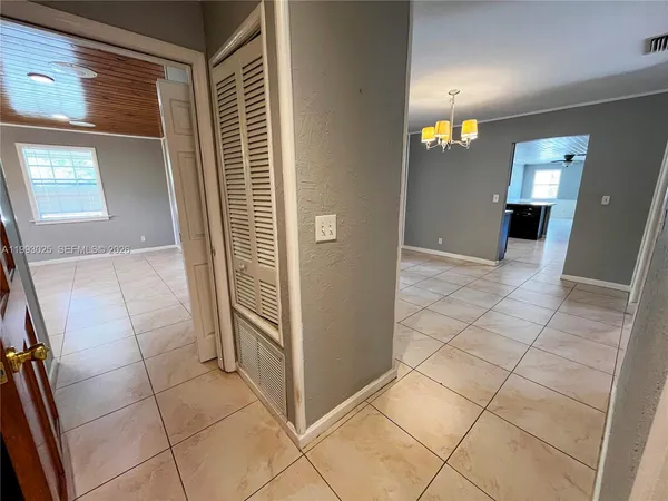a bathroom with a sink a toilet a tub and shower