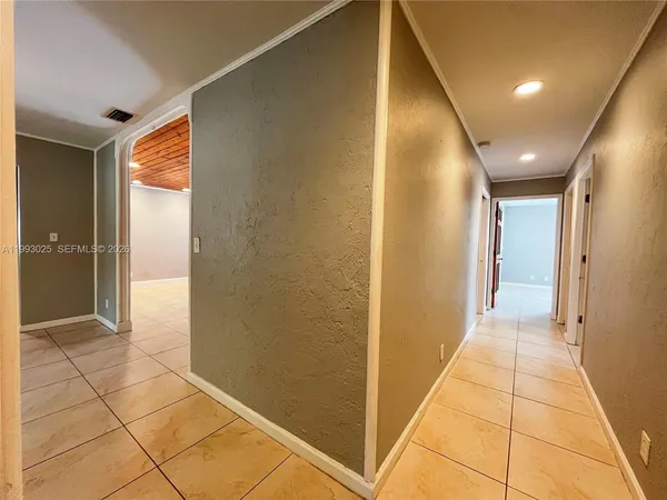 a view of an empty room with closet area