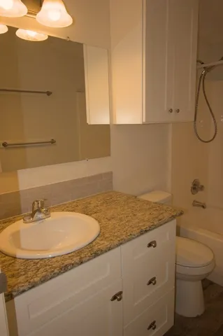 a bathroom with a sink and mirror