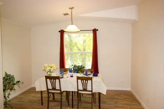 a view of a dining room with furniture window and outside view